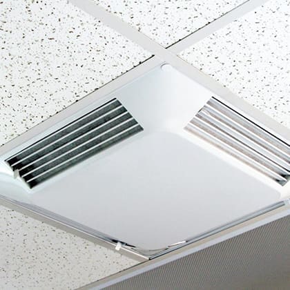 Ceiling-mounted ventilation system with adjustable vents.
