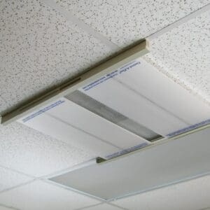 Air filter installed in a ceiling light fixture.